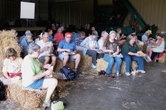 Tour group enjoying a delicious box lunch in the barn
