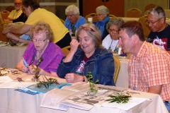 Nancy Kast, Norah Otto, and Tom Bruning working on their designs