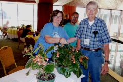 Flower Show Entries aide Mary Schaeffer assisting first-time exhibitor Larry Force