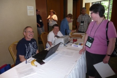Entries Chair Paul Susi assisted by Emma Bygott helping Julie Thompson