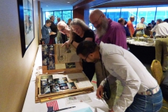Julie Mavity-Hudson showing Bob Clark and Wen Fang the history of the Tennessee Chapter