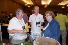 Nancy Kast (right) discussing her entries with Bev Williams and Brett Flewelling