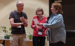Practice judging team discussing their results