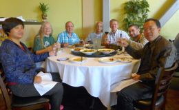 Dinner group enjoying a meal at a local restaurant