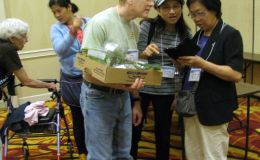 Rob & Olive Robinson and Mary Wang chat while shopping