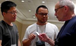 Wen Fang (center) introduces Fan Zhi-Wei to Paul Susi