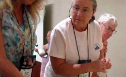 Cindy Eastman and Barbara Stewart check out the saintpaulia giveaways
