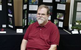 Ray Ruger, Packet co-Chair, in front of the Educational Division exhibits Ray Ruger, Packet co-Chair, in front of the Educational Division exhibits