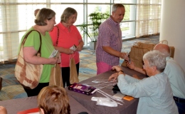 Phyllis and Pat Savage and Jim Roberts registering