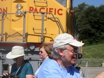 Joan Wood, Mary Schaeffer and Mel Grice at the top of the hill with the Union Pacific train engine