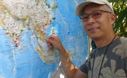 Hung Nguyen putting a marker at his native Vietnam home on the world map of garden visitors