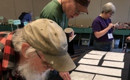 David Pierce, Jon Dixon, and Sarah Ingalls looking to buy at the Seed Fund table