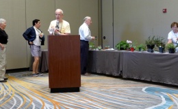Auctioneer Bill Price with helpers Joan Wood, Francisco Correa, Michael Riley, and Molly Schneider
