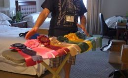 Awards Chair Paul Susi ironing special award ribbons Awards Chair Paul Susi ironing special award ribbons