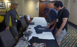 Back at the hotel – Hung Nguyen displaying the 2018 tee-shirts