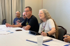 President Julie Mavity-Hudson, Secretary Leonard Re and others
