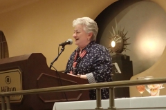 Registrar Mary Helen Maran giving convention stats