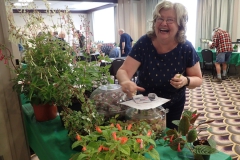 Mary Schaeffer grooming her plants at entries