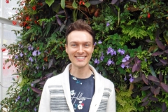 Scott Ammann with several gesneriads planted in the wall