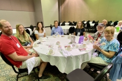 Students and parents and others at lunch