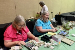 Treasurer Phyllis Savage with Pat Savage counting money