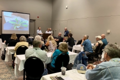 Judging team explaining their conclusions