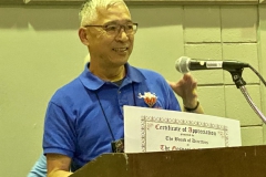 Hung Nguyen receiving his Award of Appreciation