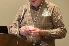Tom Bruning calling door prize numbers