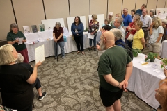 Karyn Cichocki discussing artistic entries in the show