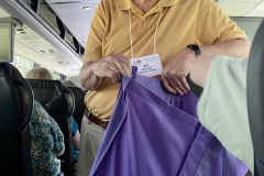 Trip volunteer Bill Schmidt handing out snacks