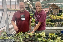 Winston Goretsky and Bill Price discussing greenhouse plants
