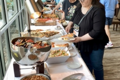 Enjoying pizza, sandwiches and other lite fare at the social