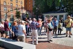 Tour guide Bill Schmidt with the group at Capitol Square
