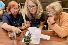 Dale Martens, Terri Vicenzi, Betsy Szymczak judging an artistic design
