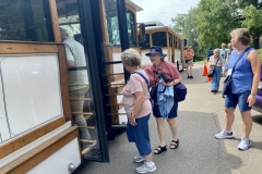 Re-boarding the trolleys to return to the hotel