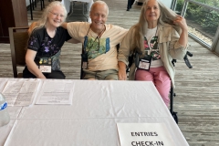 Entries check-in volunteers Julie Mavity-Hudson, Bill Price, Jeanne Katzenstein