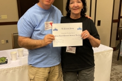 President Mel Grice presenting Ginny Heatter with the charter for the new combined chapter in New Jersey