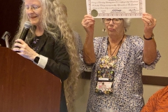Julie Mavity-Hudson awarding Leonard Re this year’s Award of Appreciation