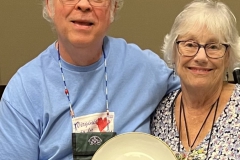 Mel Grice receiving his out-going president’s gift from Molly Schneider