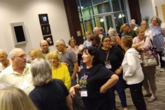 Attendees line up awaiting entry into Plant Sales by registration number