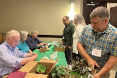 Brian Trader, first-time conventioneer, buying many new gesneriads to add to the Lewis Ginter Garden collections