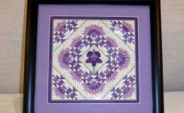 Needlework of a primulina flower exhibited by Vicki Ferguson